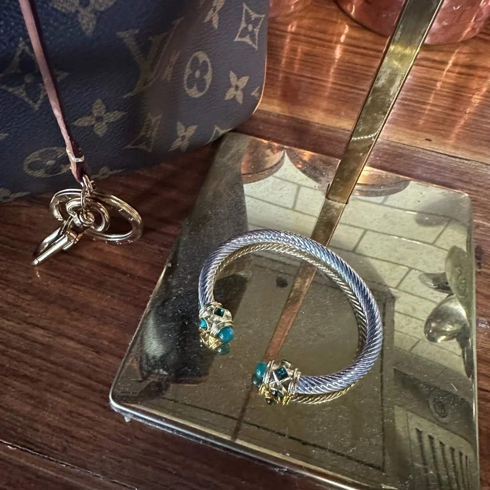 Sophisticated Silver and Gold Bracelet with Green Gemstones